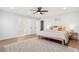 Spacious bedroom with en suite bathroom access, recessed lighting, and wood-look flooring at 3316 W Ballast Point Blvd, Tampa, FL 33611