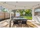 Covered patio with outdoor dining table and chairs, perfect for entertaining at 3316 W Ballast Point Blvd, Tampa, FL 33611
