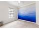 Bedroom features a blue mural, natural lighting, and carpeted floors at 3405 W Cherry St, Tampa, FL 33607