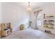 Bright bedroom with carpeted floor, toy kitchen, play house, and decorative chandelier at 3405 W Cherry St, Tampa, FL 33607