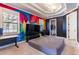 Bright bedroom featuring a mural, large tv, and two separate closets at 3405 W Cherry St, Tampa, FL 33607