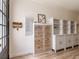 Inviting entryway featuring wood-look flooring, built-in cabinets and drawers, and stylish decor at 3405 W Cherry St, Tampa, FL 33607