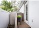 Side yard area with a storage shed, planter box, and access to the main house, providing practical outdoor space at 3405 W Cherry St, Tampa, FL 33607
