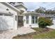 Charming single-story home featuring a landscaped front yard, brick pathway, and double-door entryway at 3405 W Cherry St, Tampa, FL 33607