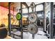Well-equipped home gym with weight racks, bars, and training equipment for a complete workout experience at 3405 W Cherry St, Tampa, FL 33607