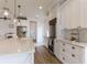 Beautiful kitchen with an island, white cabinets, stainless steel appliances, and wood flooring at 3405 W Cherry St, Tampa, FL 33607