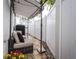 Secluded patio area with comfortable seating, potted flowers, and privacy fencing, creating a tranquil outdoor space at 3405 W Cherry St, Tampa, FL 33607