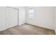 Bedroom with closet space, and a window providing natural light at 4275 Big Sky Dr, Spring Hill, FL 34604