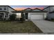 Charming single-story home featuring a two-car garage and well-maintained front yard with manicured landscaping at 4275 Big Sky Dr, Spring Hill, FL 34604