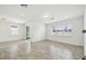Bright, spacious living room with large windows and sliding glass doors for seamless indoor-outdoor living at 4275 Big Sky Dr, Spring Hill, FL 34604