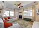 Bright living room featuring wood-look floors, a ceiling fan, and ample natural light at 4332 72Nd N Ave, Pinellas Park, FL 33781