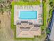 Aerial view of a community pool with lounge chairs at 4372 Water Oak Way, Palm Harbor, FL 34685