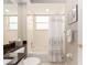 Clean bathroom features a tub, white tile, granite countertop, and decorative accents at 4372 Water Oak Way, Palm Harbor, FL 34685
