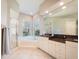 Bathroom featuring a soaking tub, walk-in shower, and vanity at 4372 Water Oak Way, Palm Harbor, FL 34685