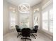 Bright breakfast nook with modern lighting and views of the outdoors at 4372 Water Oak Way, Palm Harbor, FL 34685