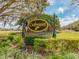The Oakmont entrance sign is surrounded by mature landscaping and trees at 4372 Water Oak Way, Palm Harbor, FL 34685