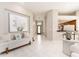 This foyer showcases a coastal design with views of a living room and kitchen area at 4372 Water Oak Way, Palm Harbor, FL 34685