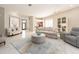Expansive living room features neutral decor, lots of natural light, and an open floor plan at 4372 Water Oak Way, Palm Harbor, FL 34685