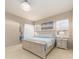 Features a comfortable bed and sliding glass doors to let in natural light at 4372 Water Oak Way, Palm Harbor, FL 34685