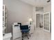 Tiled home office space features a desk, built in shelf, and natural light at 4372 Water Oak Way, Palm Harbor, FL 34685