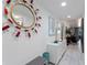 Bright hallway with decorative mirror, tiled floors, and stylish décor at 4400 37Th S St # 4, St Petersburg, FL 33711