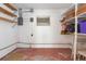 Unfinished basement with wooden shelves, exposed pipes and electrical box at 4517 S Renellie Dr, Tampa, FL 33611