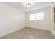 Bedroom with large window and neutral carpet at 4517 S Renellie Dr, Tampa, FL 33611