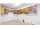 Functional kitchen with wooden cabinets and potential for modern updates and customization at 4517 S Renellie Dr, Tampa, FL 33611
