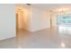 Bright living room featuring clean white walls and durable terrazzo flooring, offers a clean and spacious feel at 4517 S Renellie Dr, Tampa, FL 33611