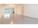 Bright living room featuring clean white walls and durable terrazzo flooring, offers a clean and spacious feel at 4517 S Renellie Dr, Tampa, FL 33611