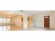 Spacious living room with terrazzo floors, natural light, and easy access to the kitchen at 4517 S Renellie Dr, Tampa, FL 33611