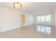 Bright living room featuring clean white walls and durable terrazzo flooring, offers a clean and spacious feel at 4517 S Renellie Dr, Tampa, FL 33611