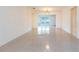 Bright living room featuring clean white walls and durable terrazzo flooring, offers a clean and spacious feel at 4517 S Renellie Dr, Tampa, FL 33611