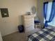 Bedroom features a dresser, small chair, and blue window accents at 4739 Myrtle Oak Dr # 21, New Port Richey, FL 34653