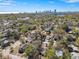 Aerial view of the home with a downtown skyline and lush trees at 511 27Th N Ave, St Petersburg, FL 33704