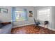Cozy bedroom featuring unique tile floors, a futon, and plenty of natural light at 511 27Th N Ave, St Petersburg, FL 33704
