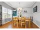 Bright dining room featuring hardwood floors, wainscotting, chandelier, and a built-in display cabinet at 511 27Th N Ave, St Petersburg, FL 33704