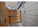 Outdoor shower with wood enclosure, multiple shower heads and convenient shelving at 511 27Th N Ave, St Petersburg, FL 33704