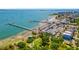 Aerial view of a coastal town featuring a pier, sandy beach, city park, and waterfront dining options at 5402 31St S Ave, Gulfport, FL 33707