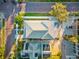 An aerial view of a charming single Gathering home with a well-manicured lawn, a brick road, and a detached garage at 5402 31St S Ave, Gulfport, FL 33707