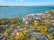 Panoramic aerial showcasing a waterfront community, beach, and scenic pier in a tranquil bay setting at 5402 31St S Ave, Gulfport, FL 33707