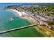 A breathtaking aerial shot captures the beach, bay, and vibrant town with lush greenery and blue skies at 5402 31St S Ave, Gulfport, FL 33707