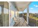This charming balcony features cozy seating, offering an inviting outdoor space at 5402 31St S Ave, Gulfport, FL 33707