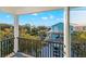 Beautiful balcony view overlooking a charming street, waterfront, and neighboring homes on a sunny day at 5402 31St S Ave, Gulfport, FL 33707