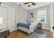 Cozy bedroom with blue accents, featuring a closet and window view at 5402 31St S Ave, Gulfport, FL 33707