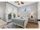 Bright bedroom with balcony access, featuring a ceiling fan and stylish decor at 5402 31St S Ave, Gulfport, FL 33707