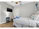 Cozy bedroom with wood floors, a ceiling fan, and plenty of natural light at 5402 31St S Ave, Gulfport, FL 33707