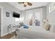 Bright bedroom features balcony, a comfortable bed, and a mounted television at 5402 31St S Ave, Gulfport, FL 33707