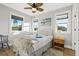 Cozy bedroom with natural light and stylish decor, featuring a comfortable bed and serene atmosphere at 5402 31St S Ave, Gulfport, FL 33707