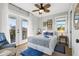 Bright bedroom with balcony access, featuring beach-themed decor and views at 5402 31St S Ave, Gulfport, FL 33707